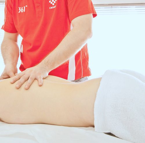 A physiotherapist’s hands during a back massage