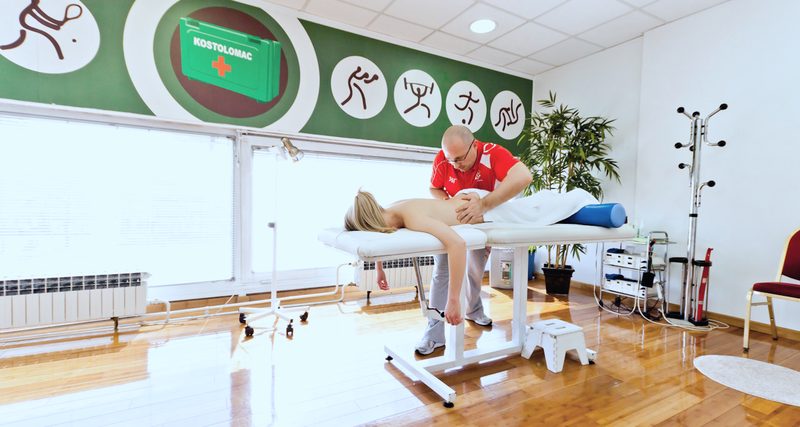 Medical massage in the practice’s bright therapy hall